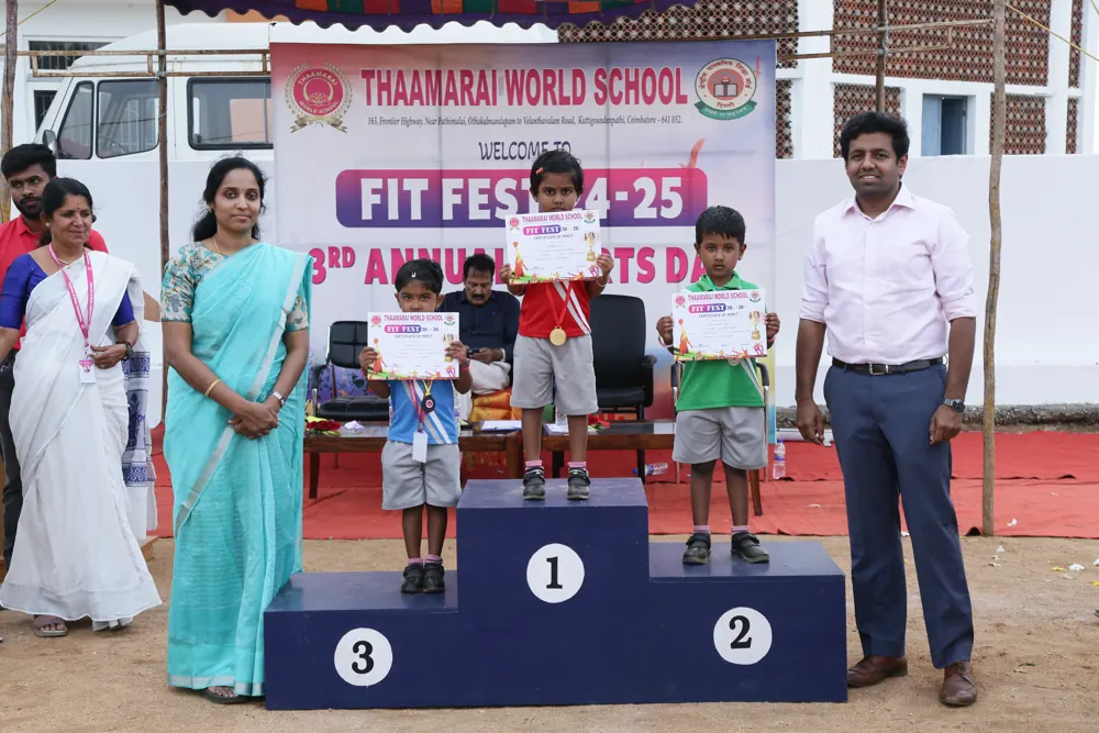 Young athletes stand on the podium at the school sports meet
